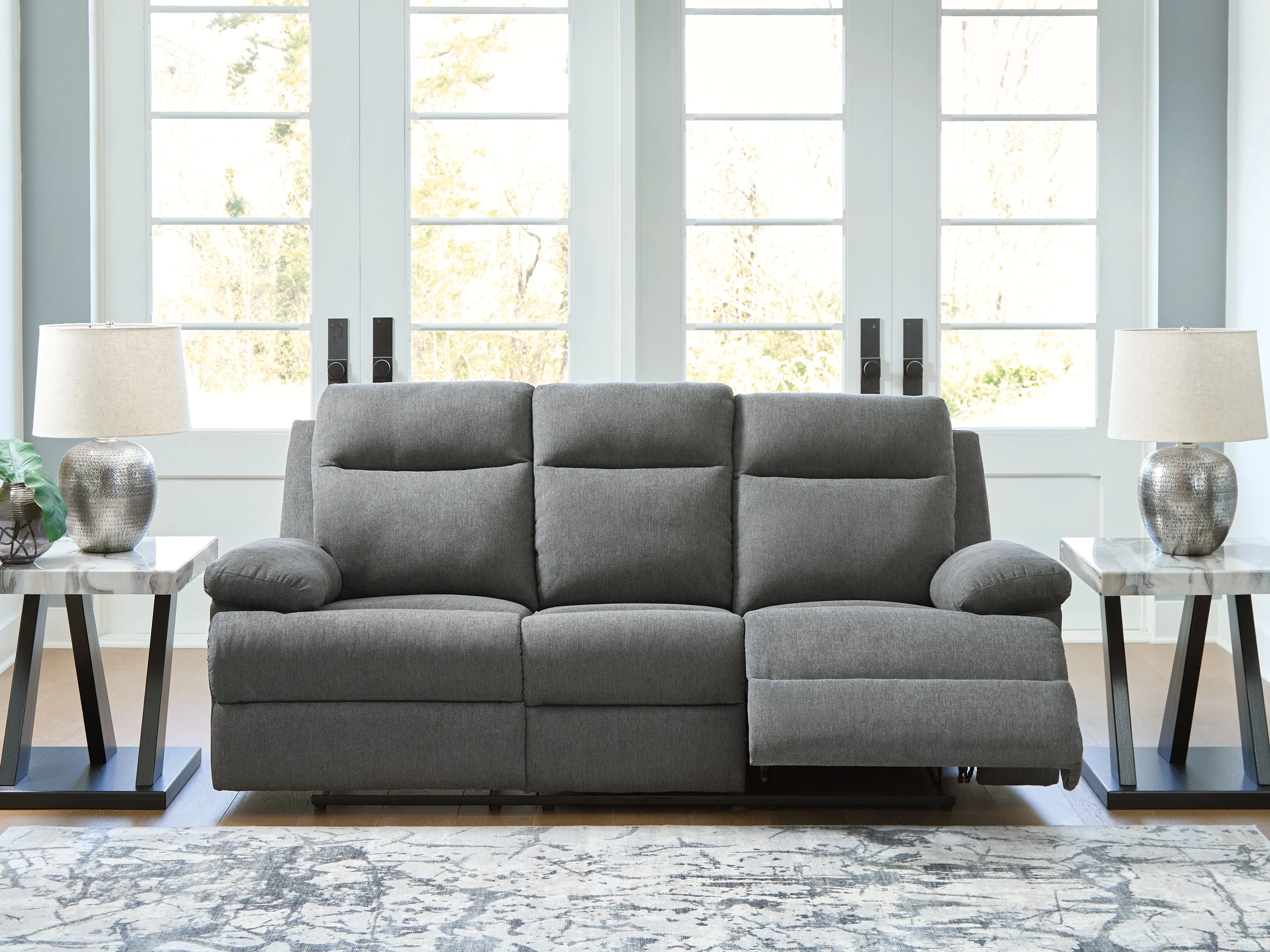 Side-Swipe Charcoal Manual Reclining Sofa with Drop Down Table
